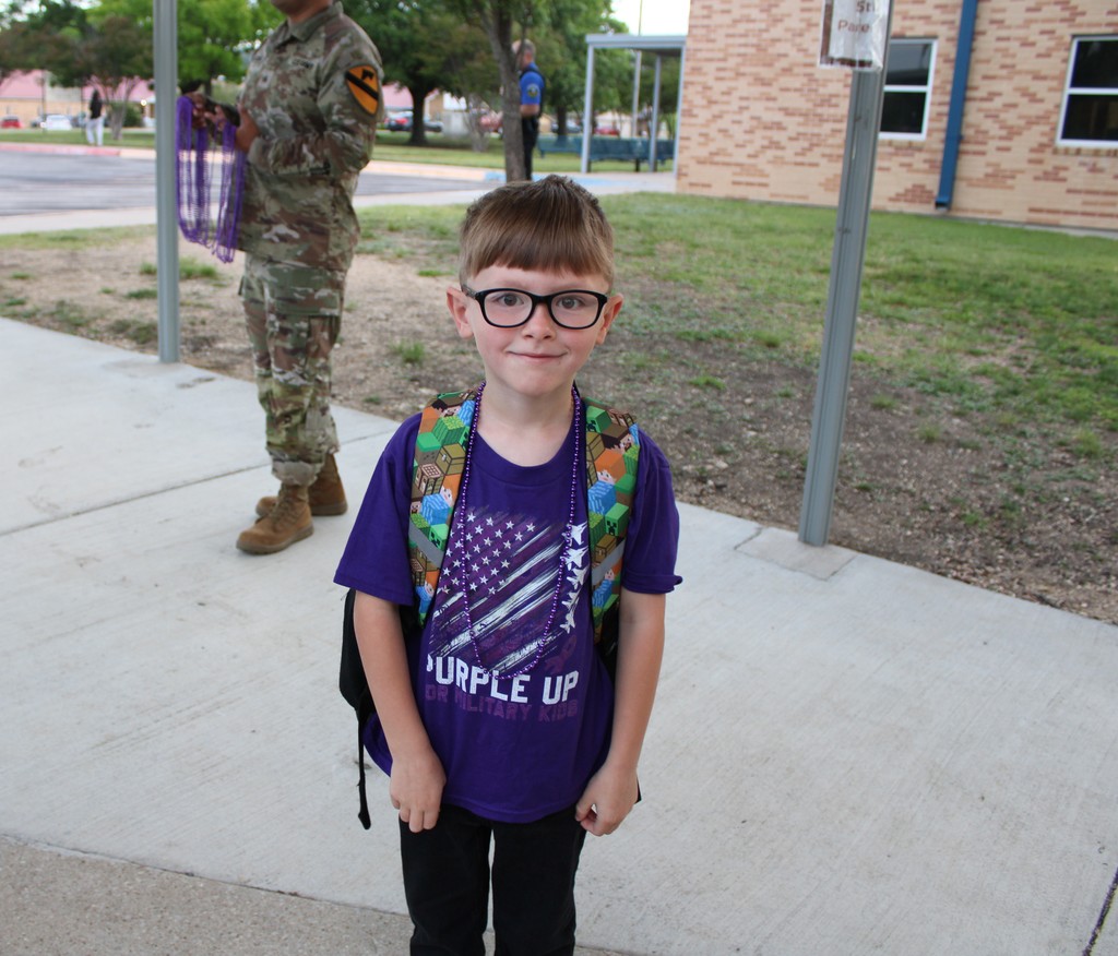Students pose for purple day