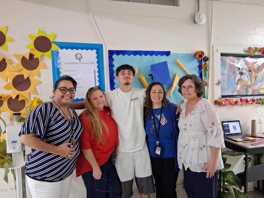 Staff and students in red, white and blue