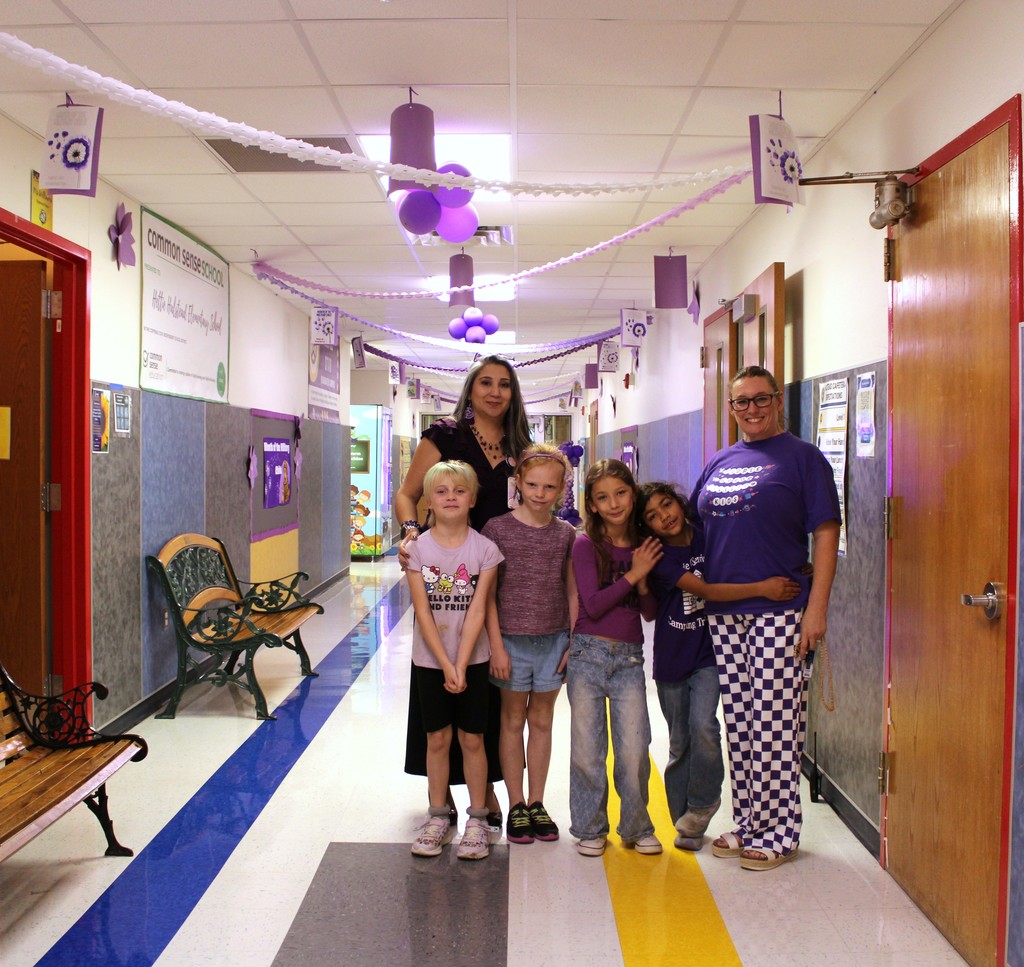 Students pose with Teachers in purple up day gear