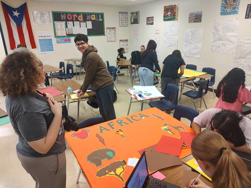 Students setting up for MULTICULTURAL NIGHT. 