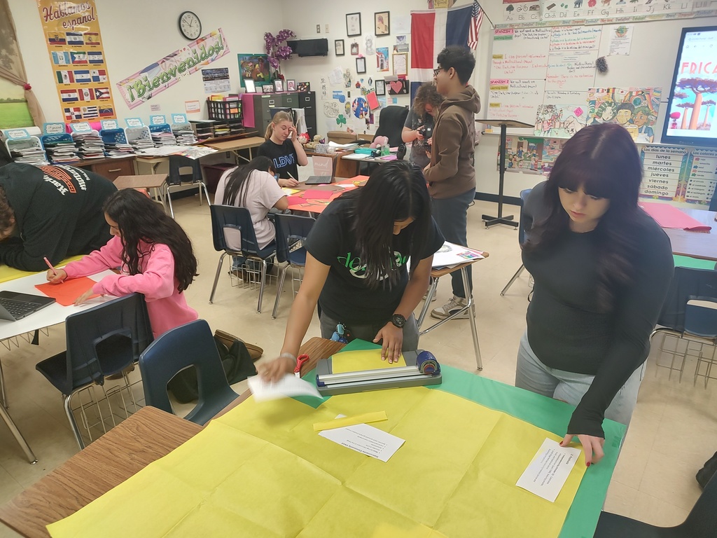 Students setting up for MULTICULTURAL NIGHT. 