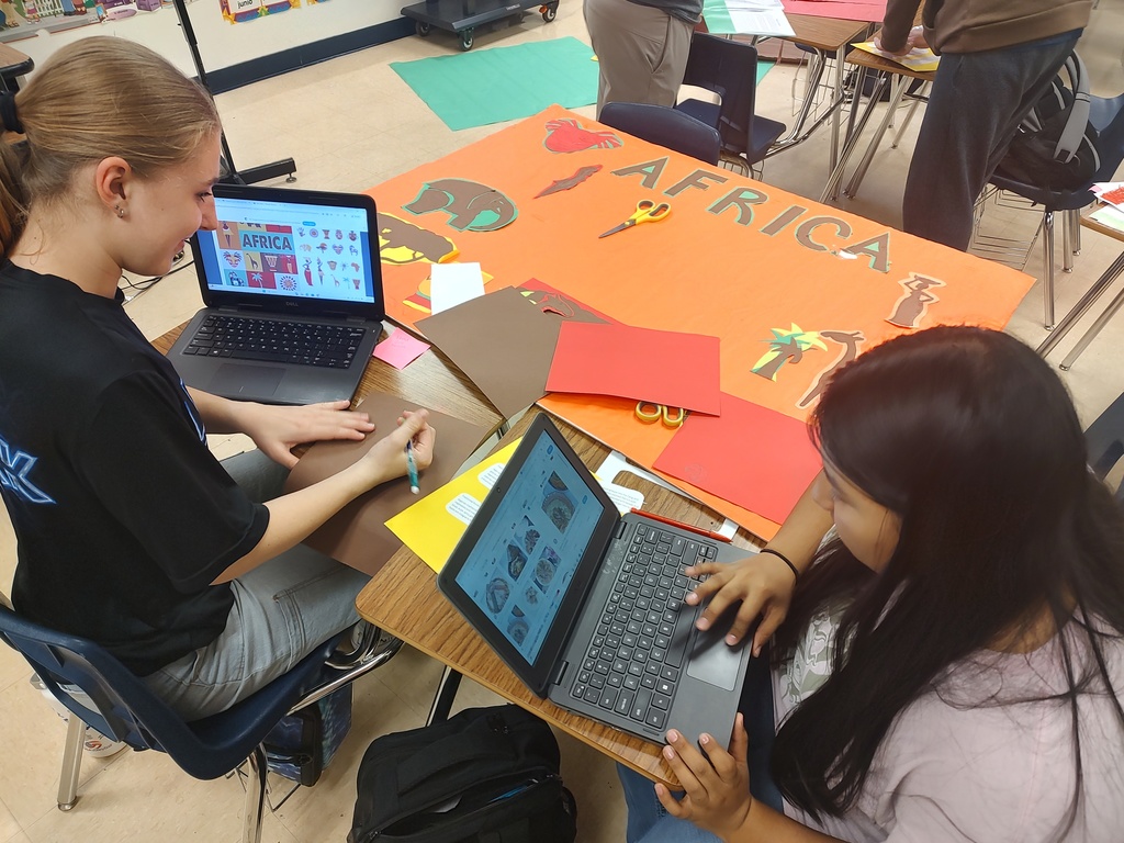 Students setting up for MULTICULTURAL NIGHT. 