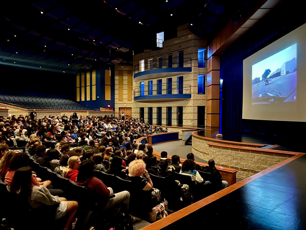 11th grade Copperas Cove High School students watching a video in the auditorium. 
