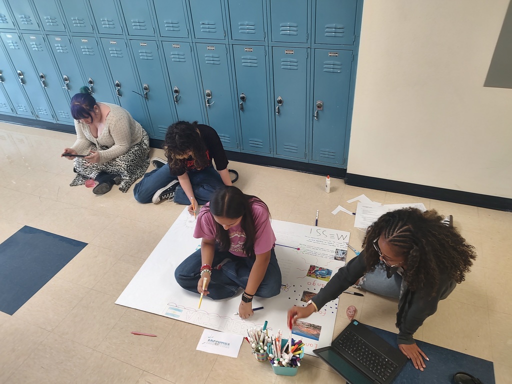 Copperas Cove High School students setting up for Multicultural Night 2026 with decorations in the hallway.
