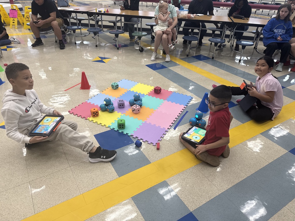 2nd grade robotics club displaying their robots 