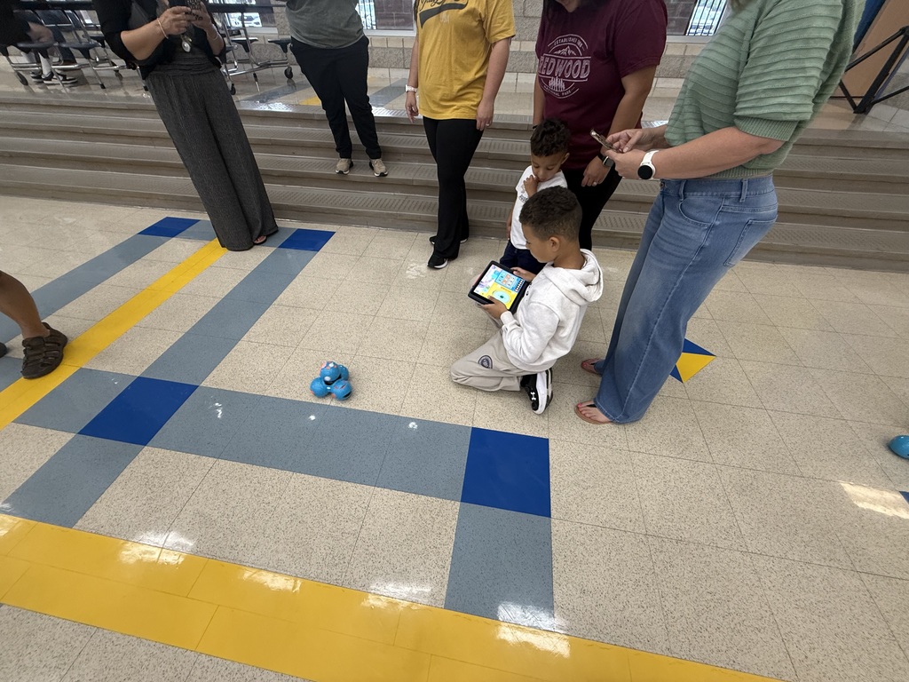 Student demonstrating robot knowledge