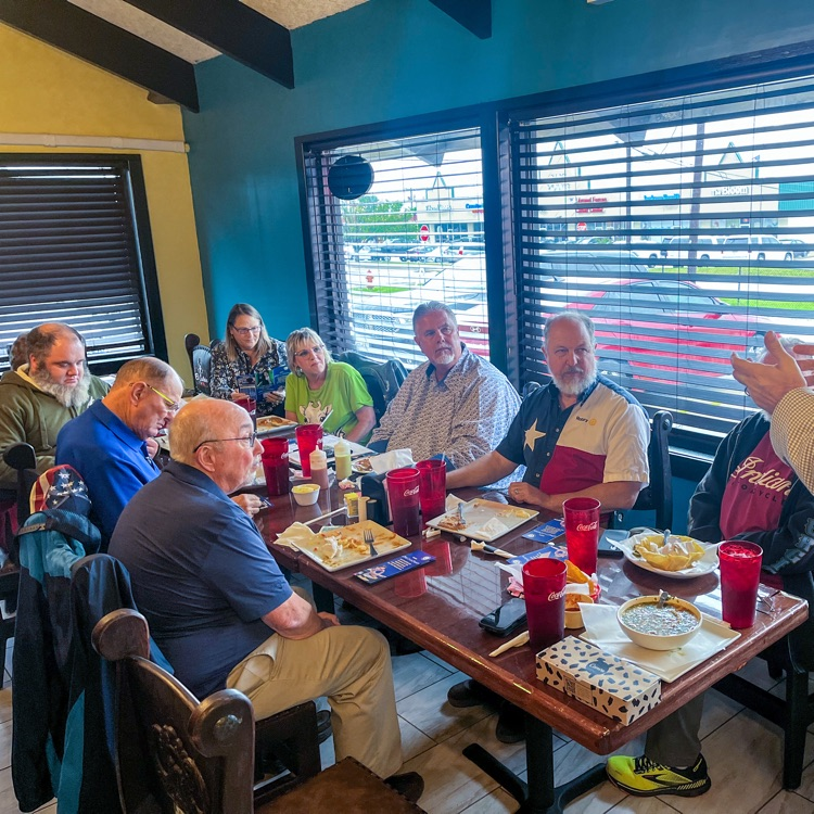 A man speaking to a room of people