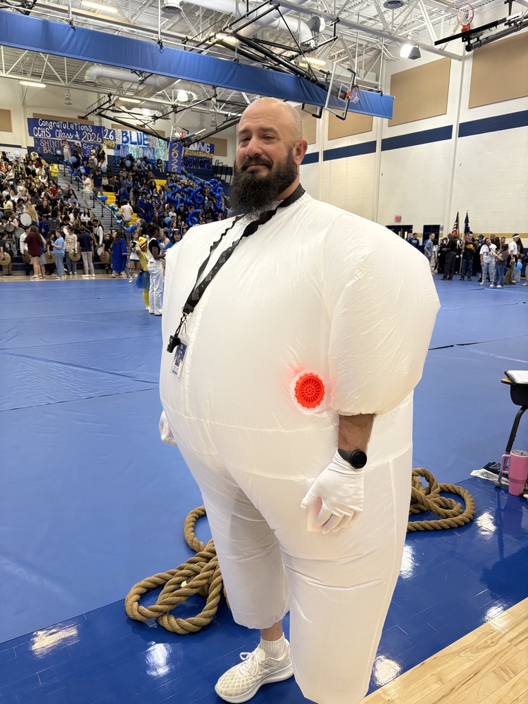 A teacher dressed up in white for the Pep Rally