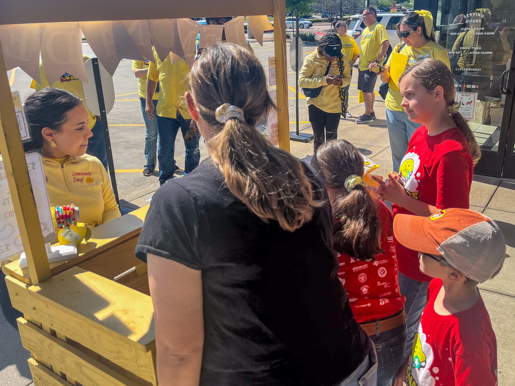 Photo of students running a lemonade day