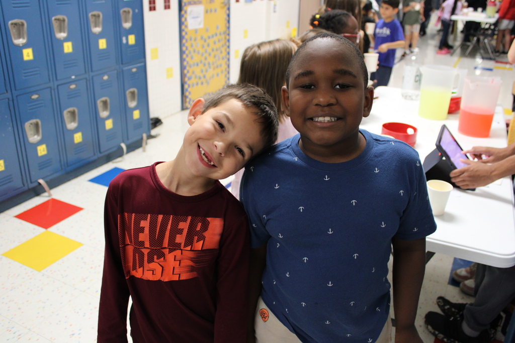 students smile and pose