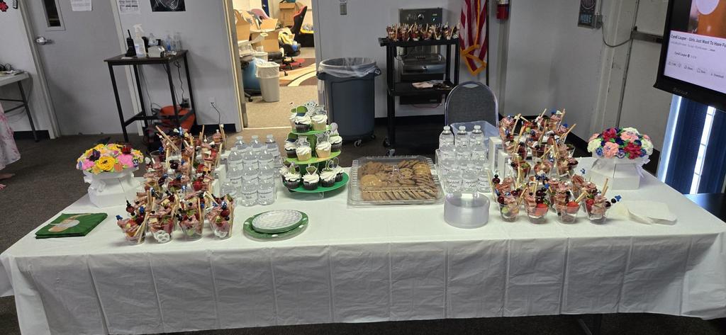 Table of snacks and cake at retirement party