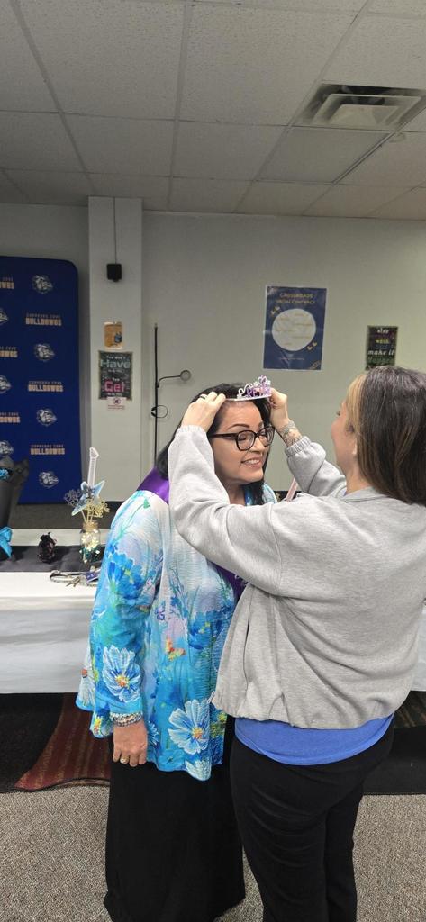 Mrs. Smith being crowned at retirement party