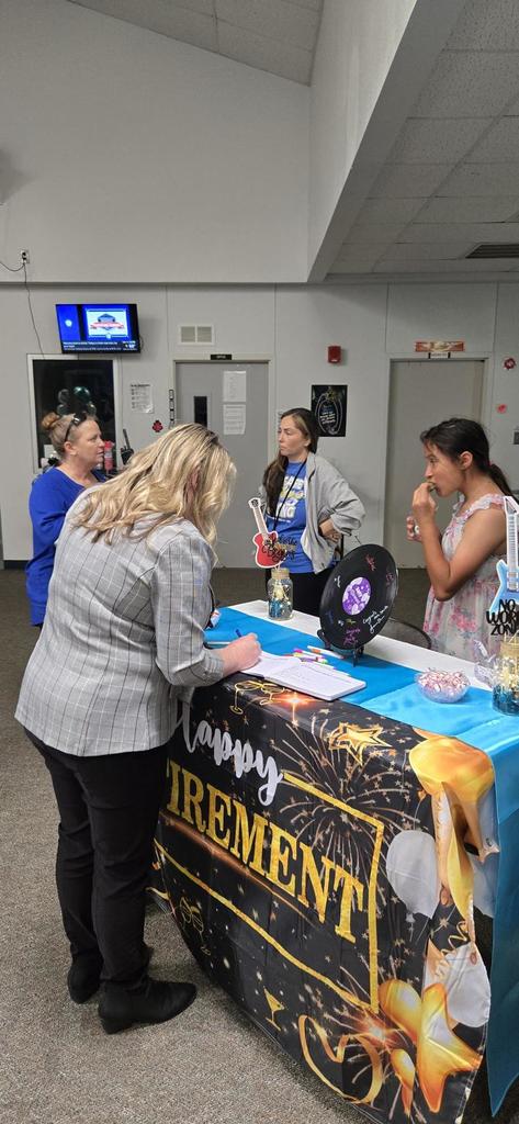 Staff socializing at retirement party