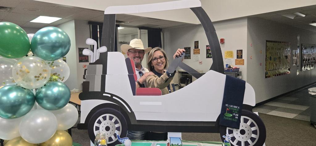 Mr. Love taking his wife for a ride in the golf cart cut out.