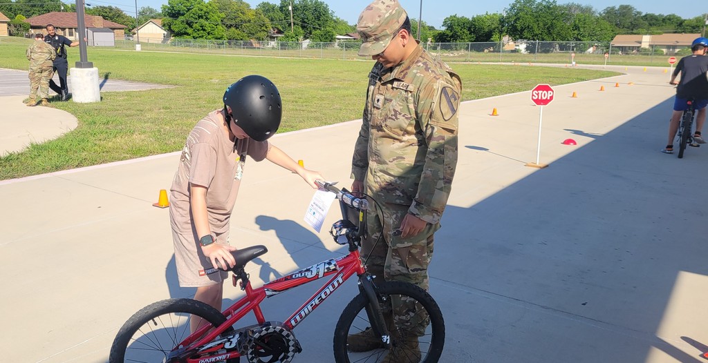 Student has bike inspected at station