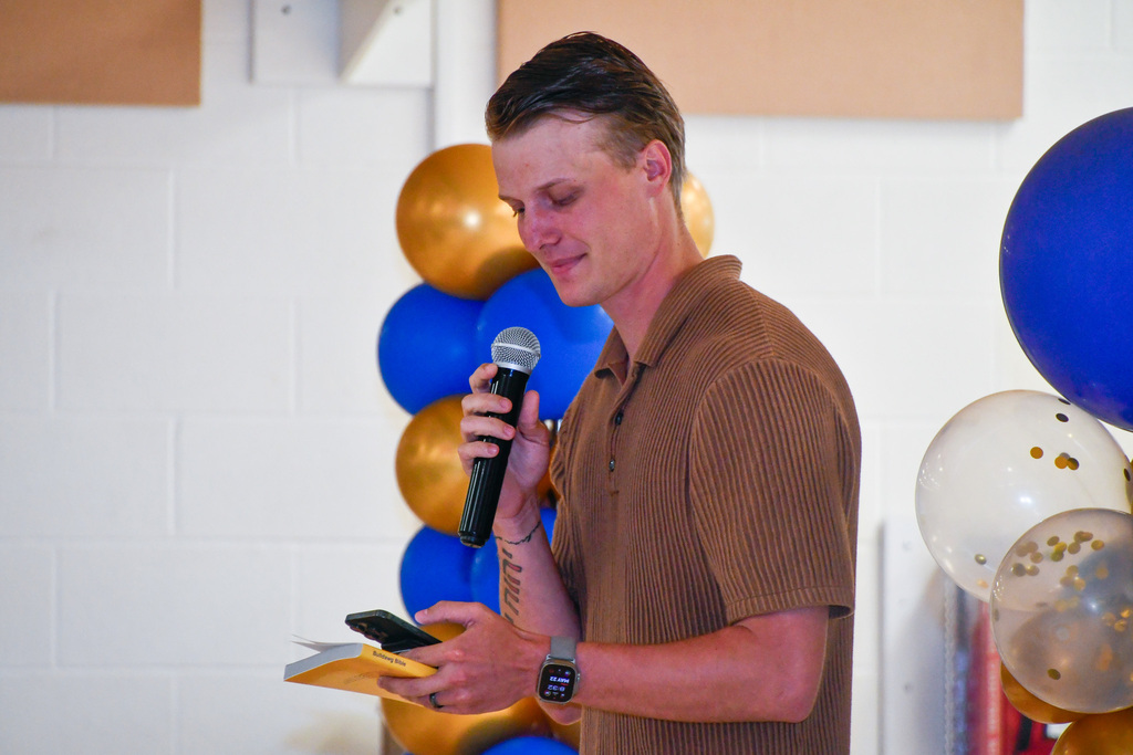 Man speaking into a microphone