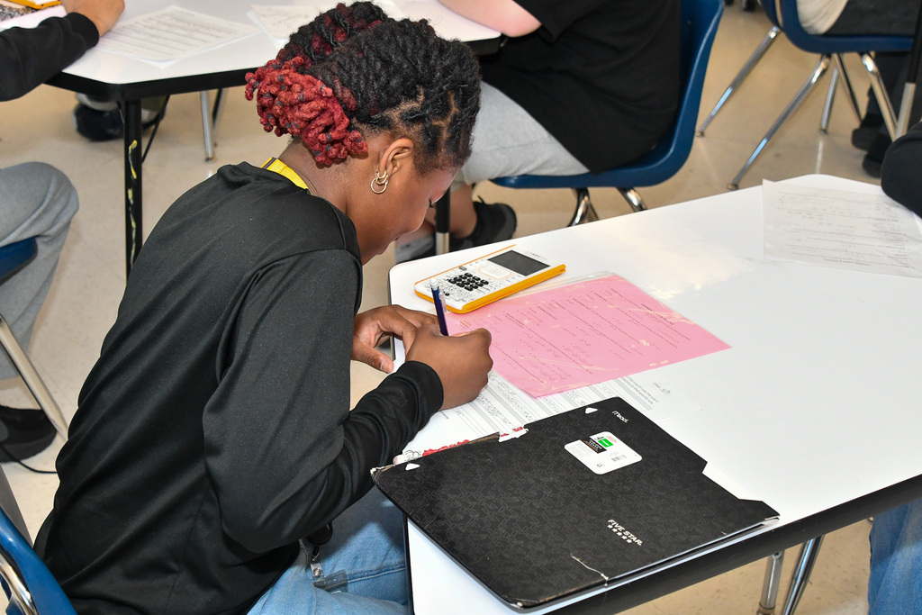 Student completing math assignment