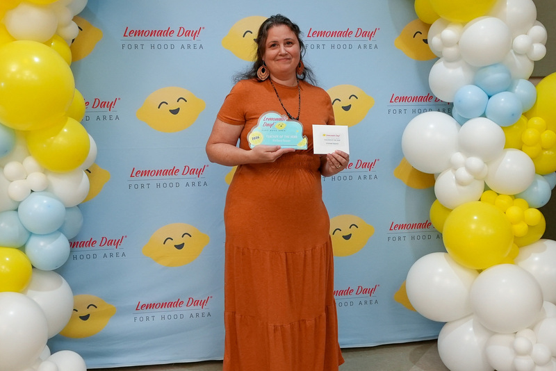 Stefanie Seaver holding awards