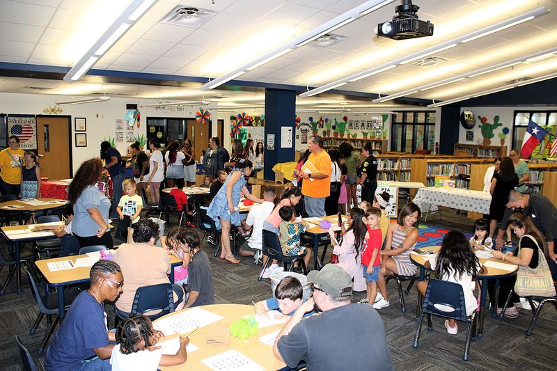 Parents and students doing activities.