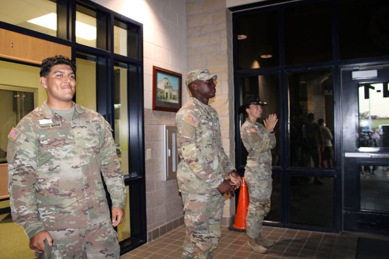 Adopt-A-Unit soldiers welcoming students.