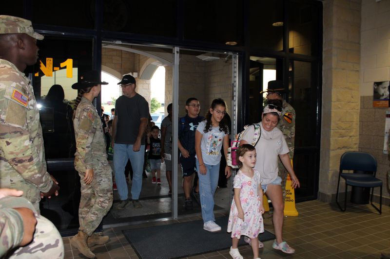 Parents and students walking in.