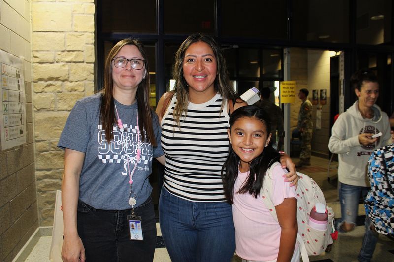 Our registrar with a parent and their student.