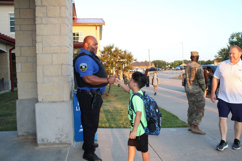 Our school marshall welcoming a student. 
