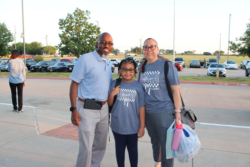 A family coming to school. 