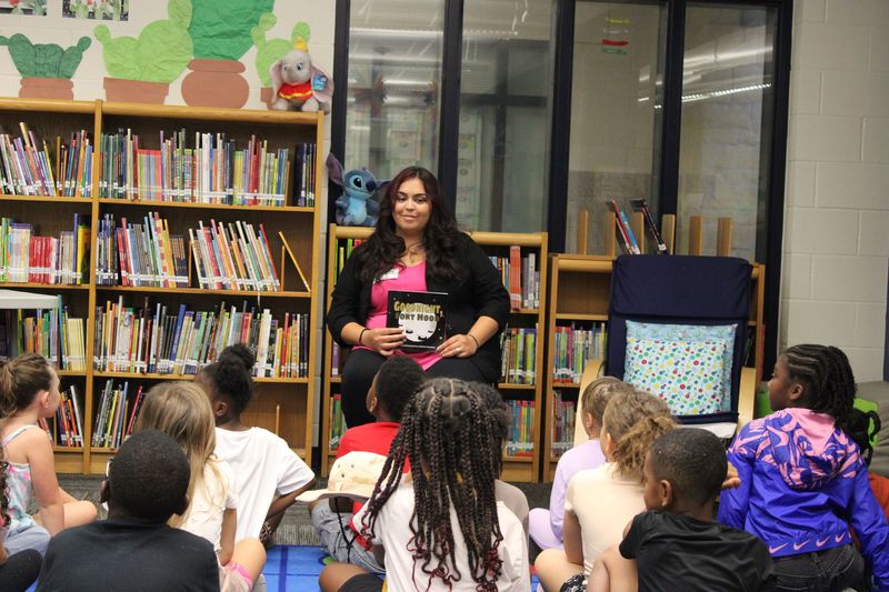 Author MyKala Guerrero reading to students.