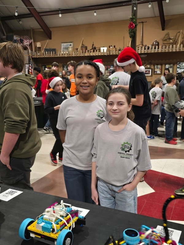 Two students with their robot.