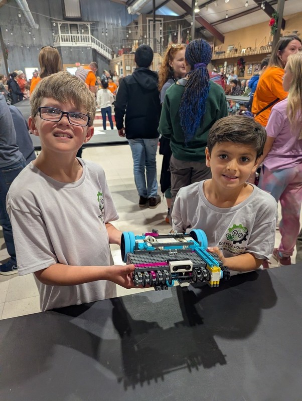 Two students and their robot.
