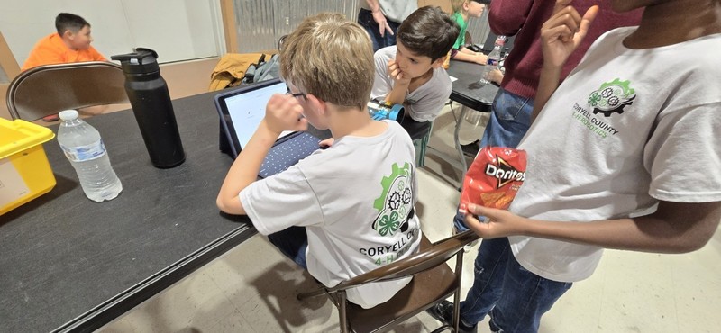 students doing robot checks before their match.