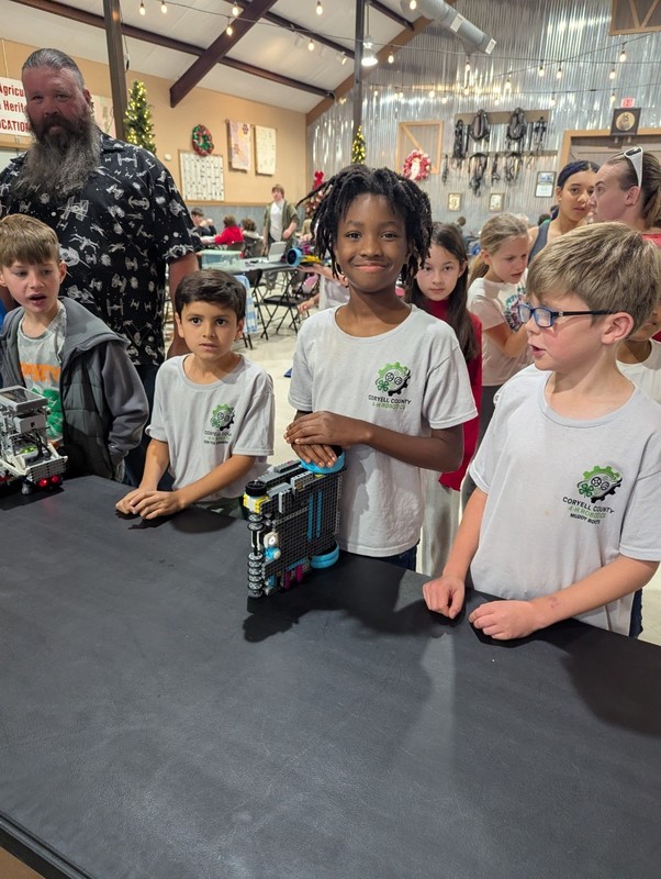 Four students and their robot.