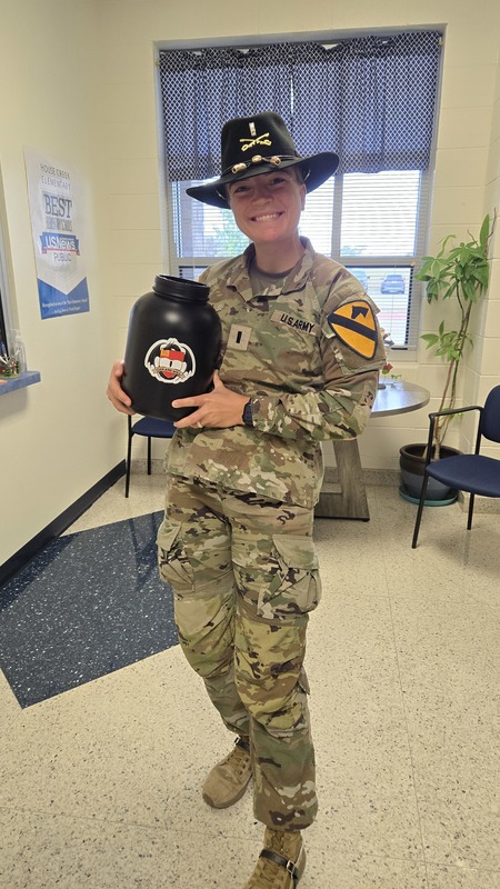 Our Adopt-A-Unit soldier dropping off their pull tabs.