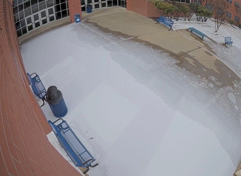 Photo of a school entryway covered in ice