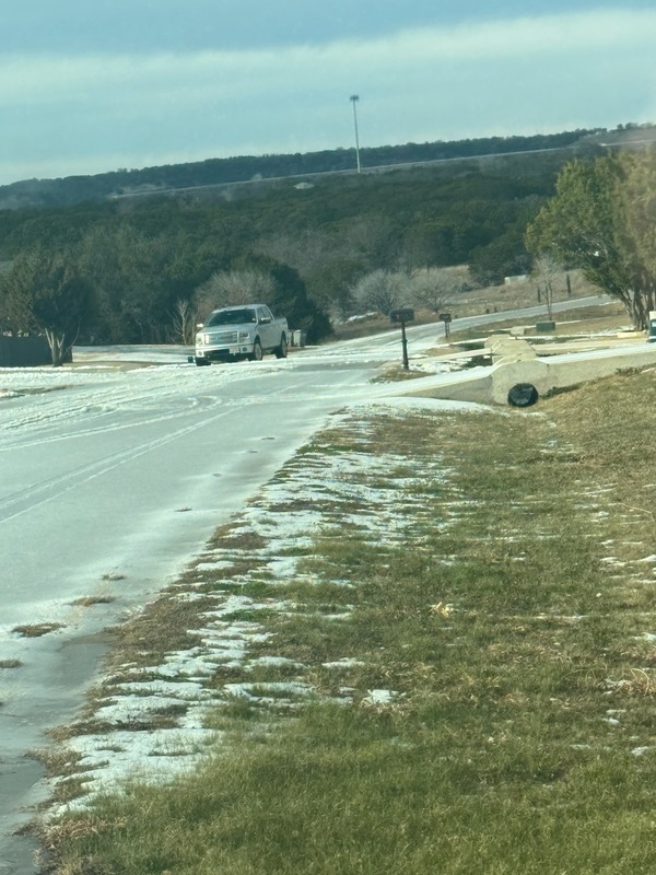 Photo of a roadway covered in ice