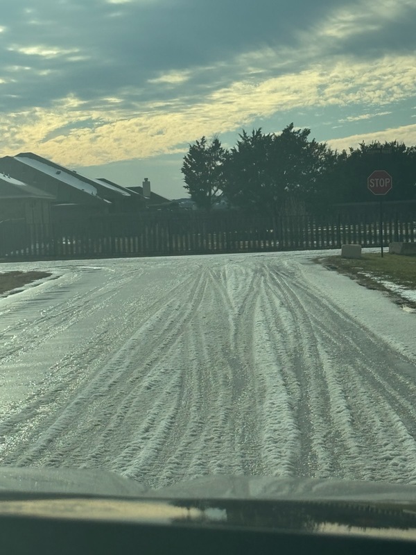 Photo of a roadway covered in ice