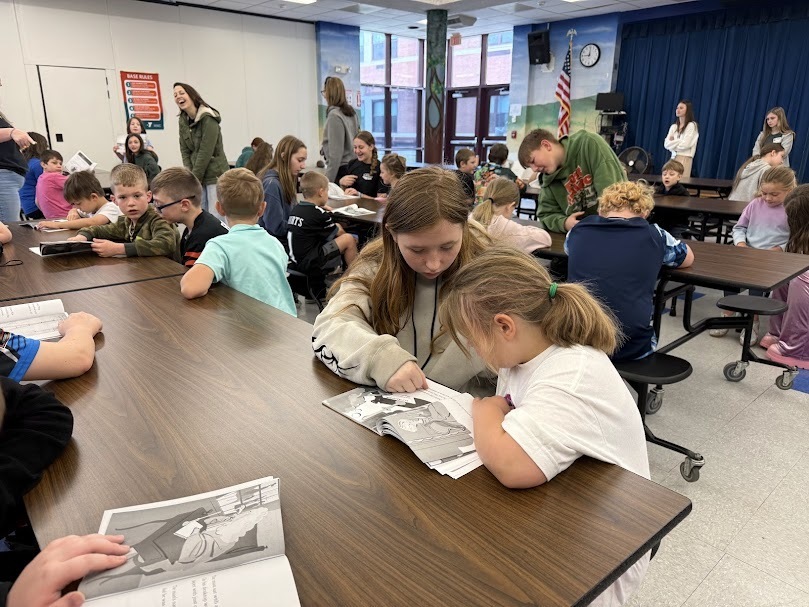 Grades 1 and 6 pens pals partner reading