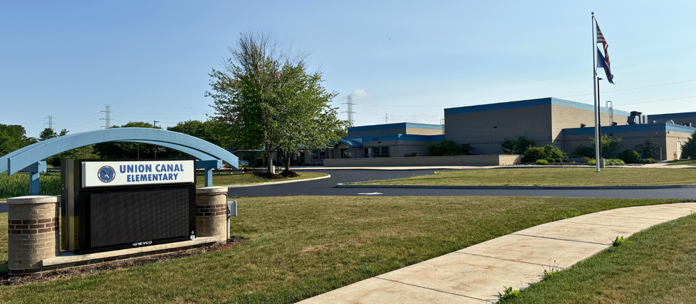 An exterior view of Union Canal Elementary School with the digital sign and American flag