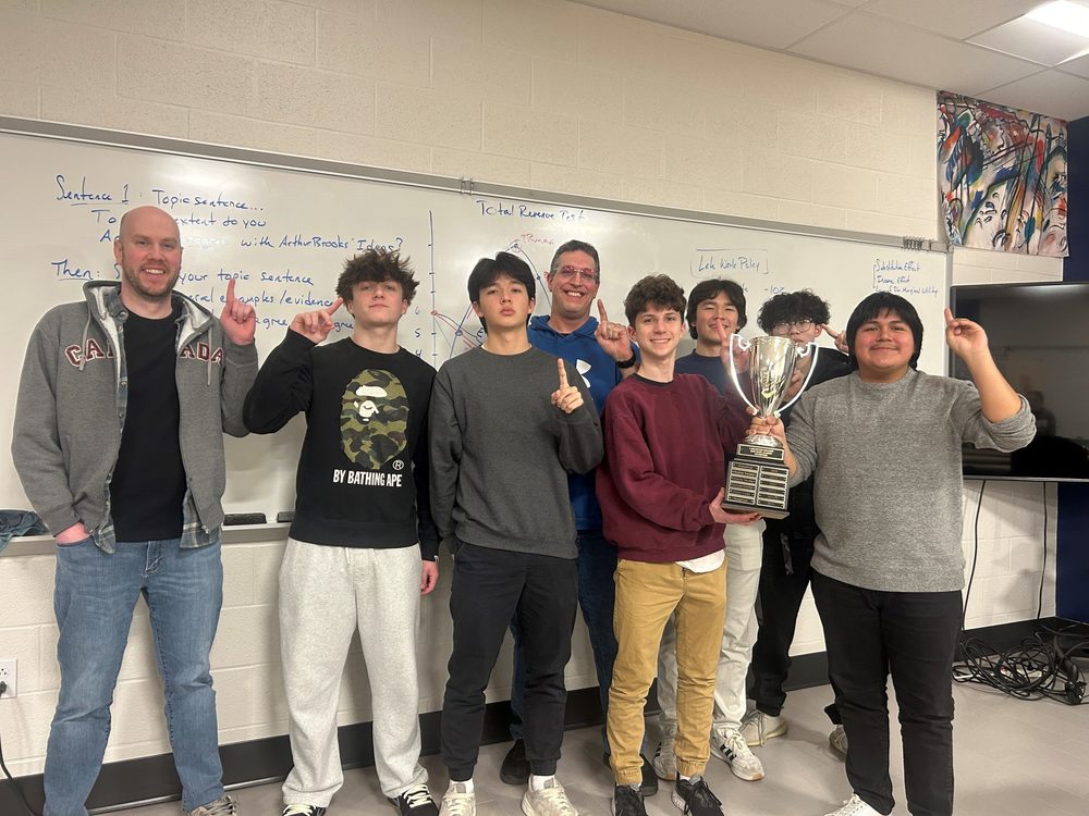 Students holding Trophy