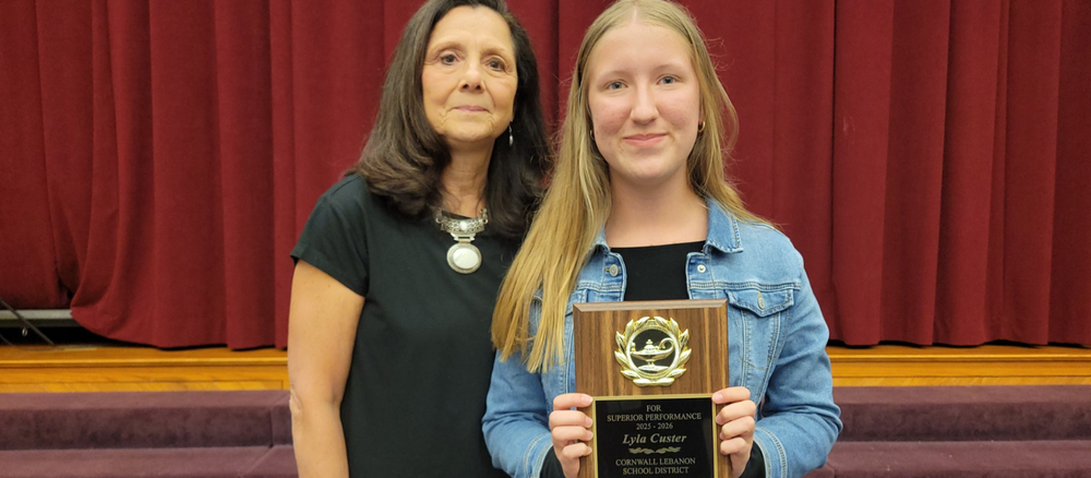 Lyla Custer holds her CCMS Student of the Year Award in a photo with CLSD Board President Ruth Ann Schlegel
