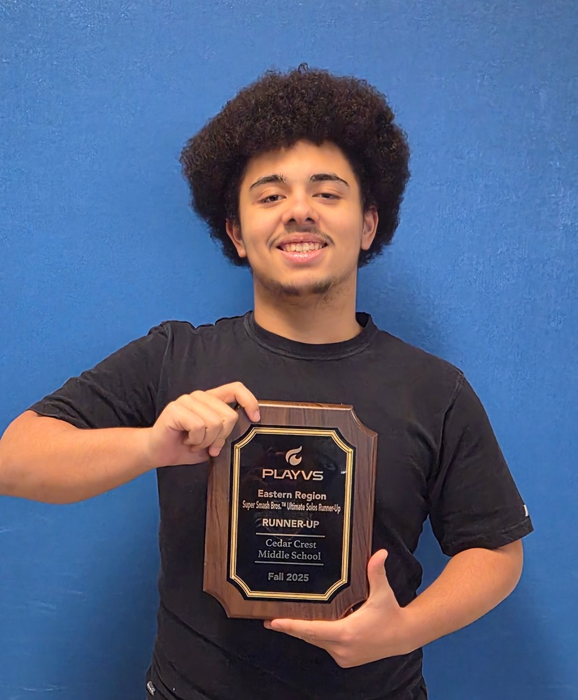 Adam Claderone holding 2nd place plaque