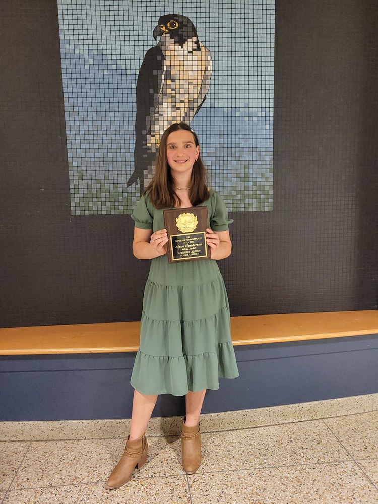 Alexa Henderson stands with her SOY plaque