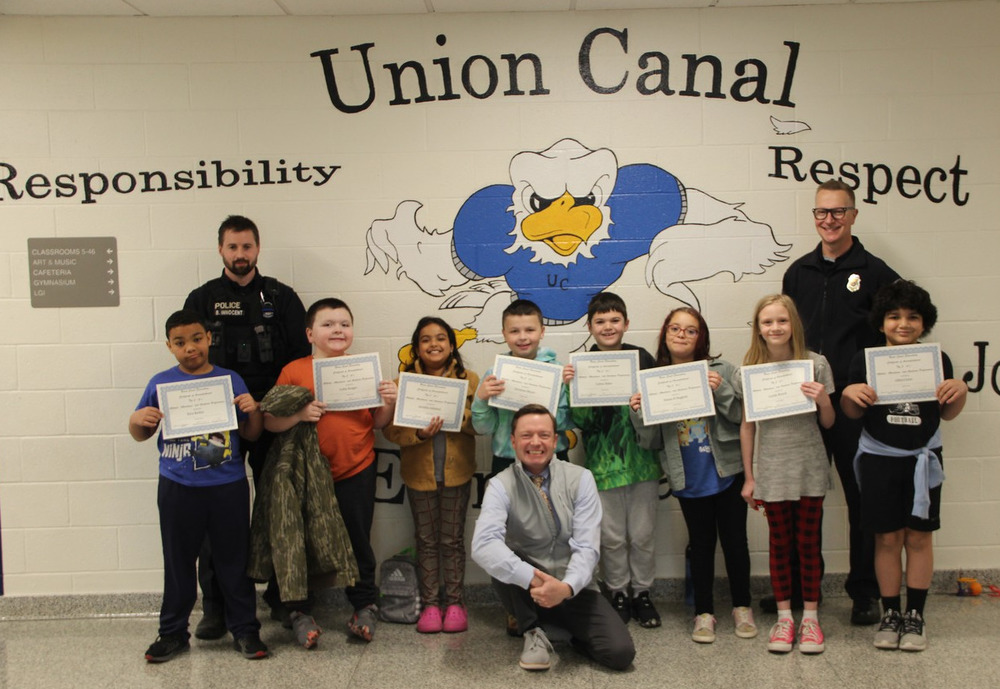 3rd grade students with certificates
