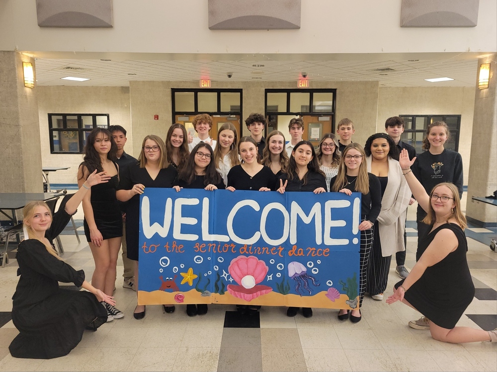 Key Club members with Welcome sign