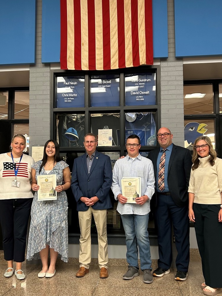 4 adults and two students receiving awards