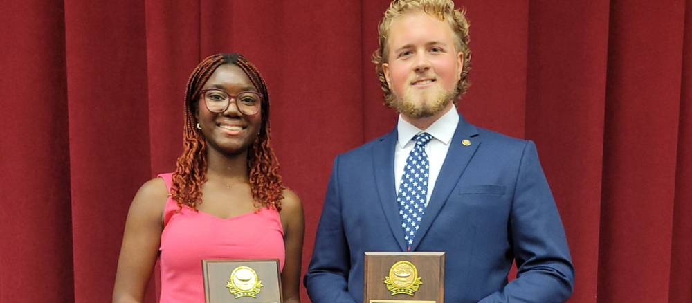 Abena Obuobia and Tanner Zimmerman hold their Student of the Year Awards
