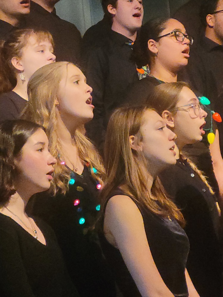 high school choir students singing