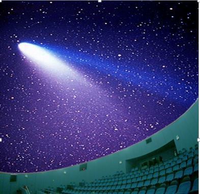 inside planetarium with star show on dome