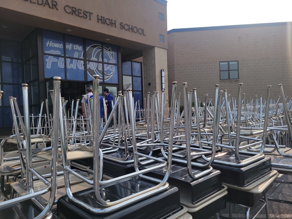 stack of student desk chairs